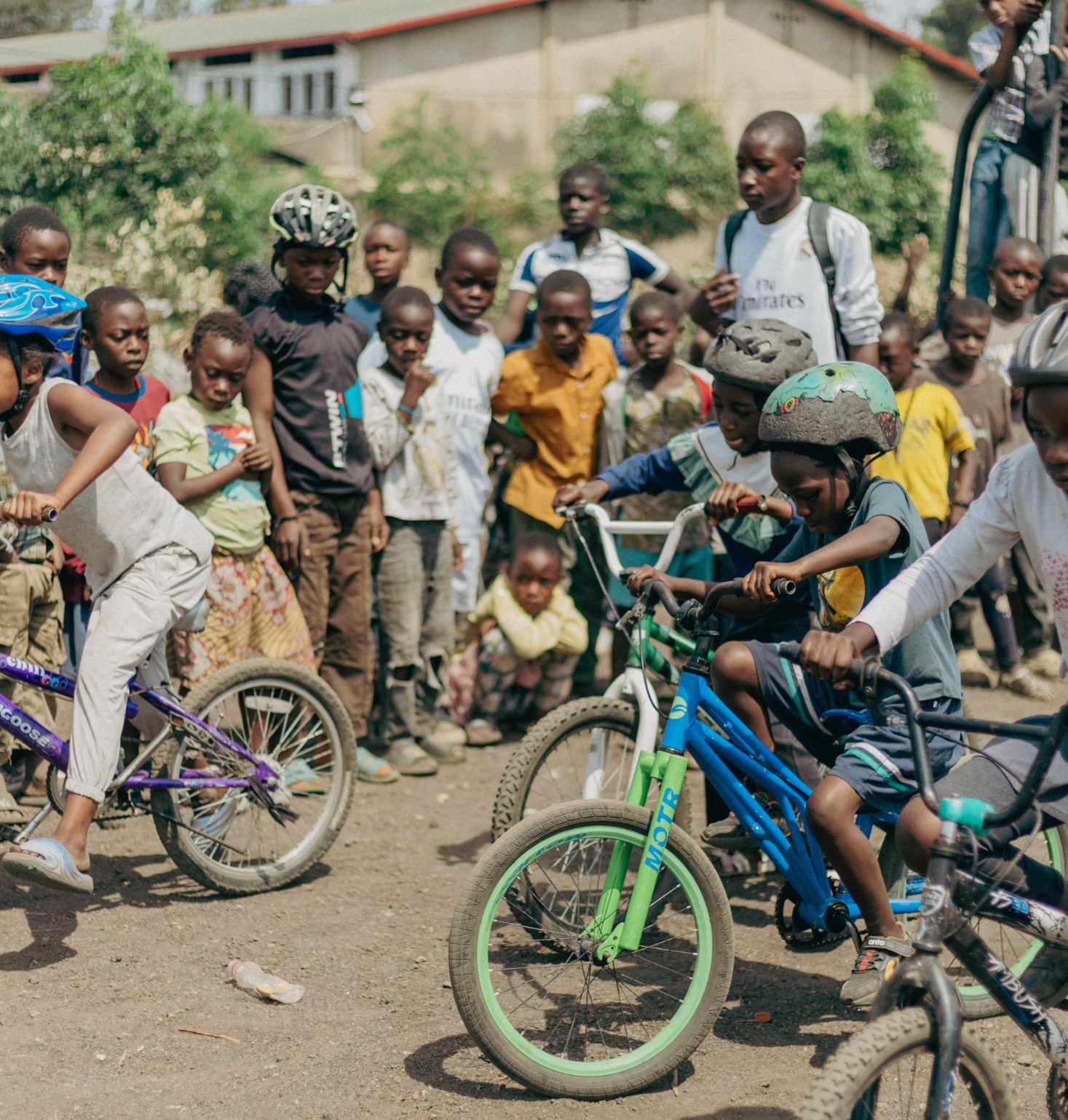 Young riders starting together on bicycles
